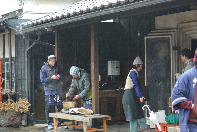 The staff members of Terada Honke busily preparing the culinary delights to serve the participants of the brewery tour as their welcome lunch.