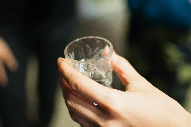 Tasting the water in the barrel.