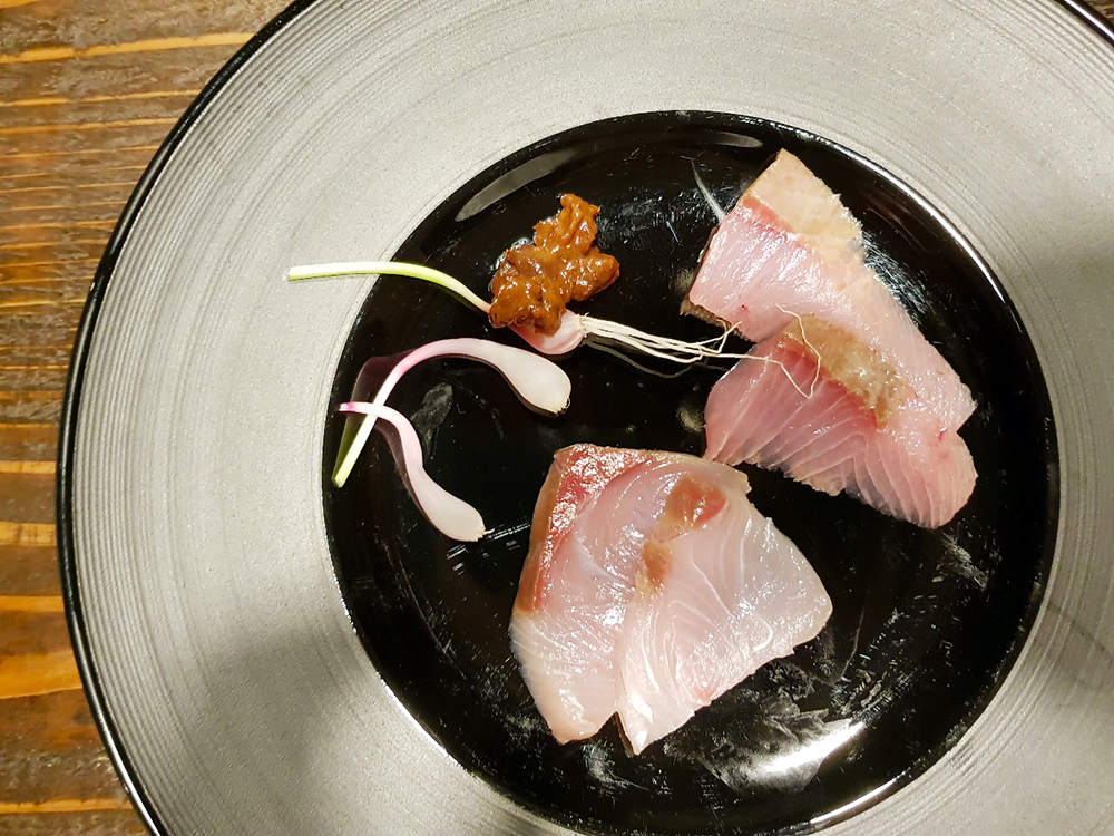 Sashimi of Japanese amberjack from Hamasaka and yellowtail, served with Allium gray and Shoyu Moromi